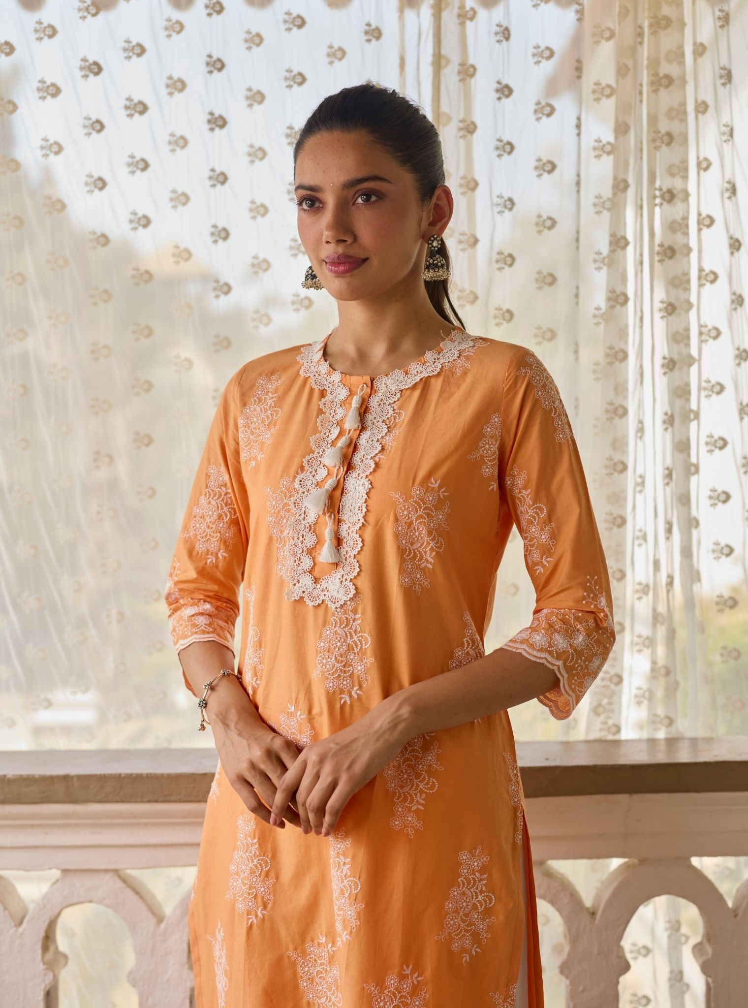 Perla Supima Cotton Orange Kurta with Floral Lace Flared White Pant Set