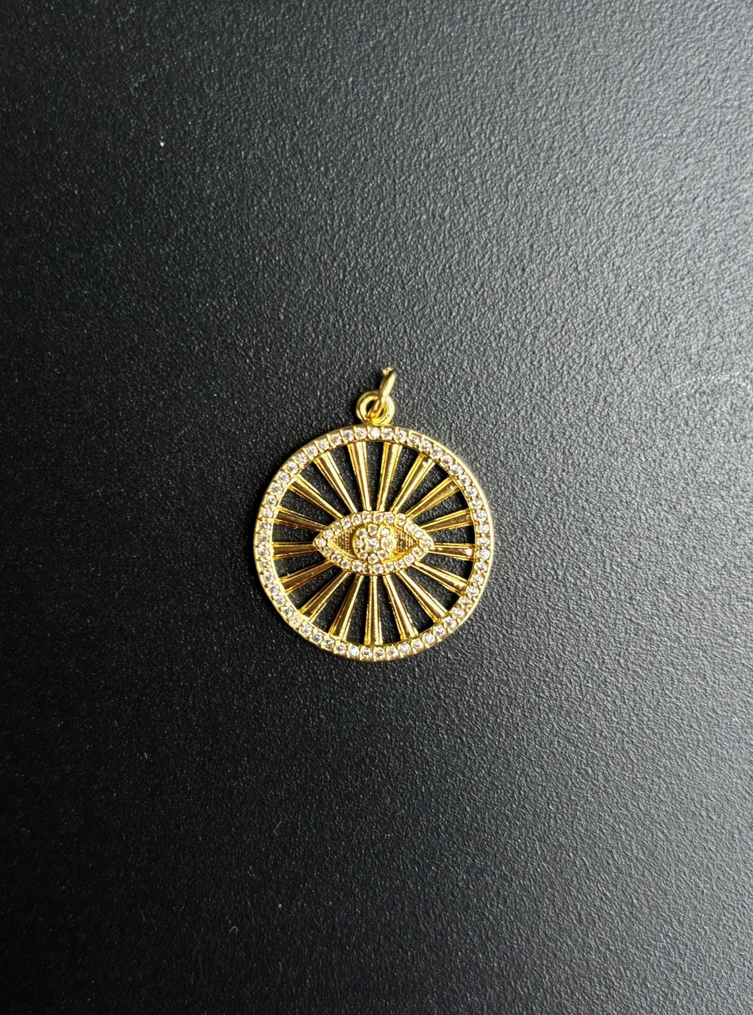 Radiant evil eye charm